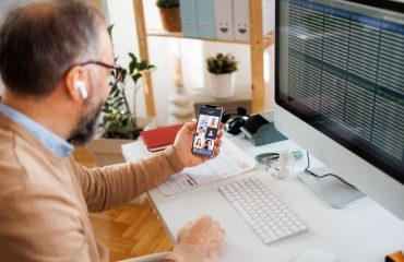 remote worker Remote worker on phone meeting and on computer