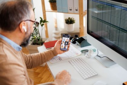 Remote worker on phone meeting and on computer