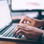 man working on open laptop