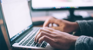 man working on open laptop